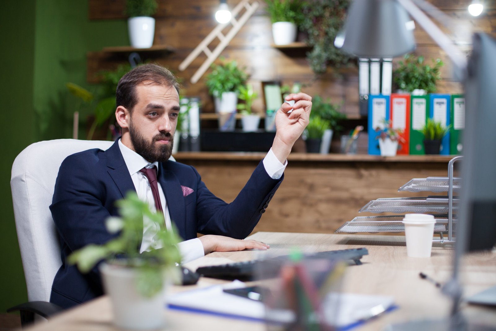 Young and elegant businessman working hard in his office. successful occupation.